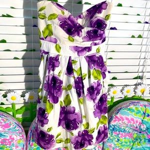 Bright purple floral print on white strapless dress